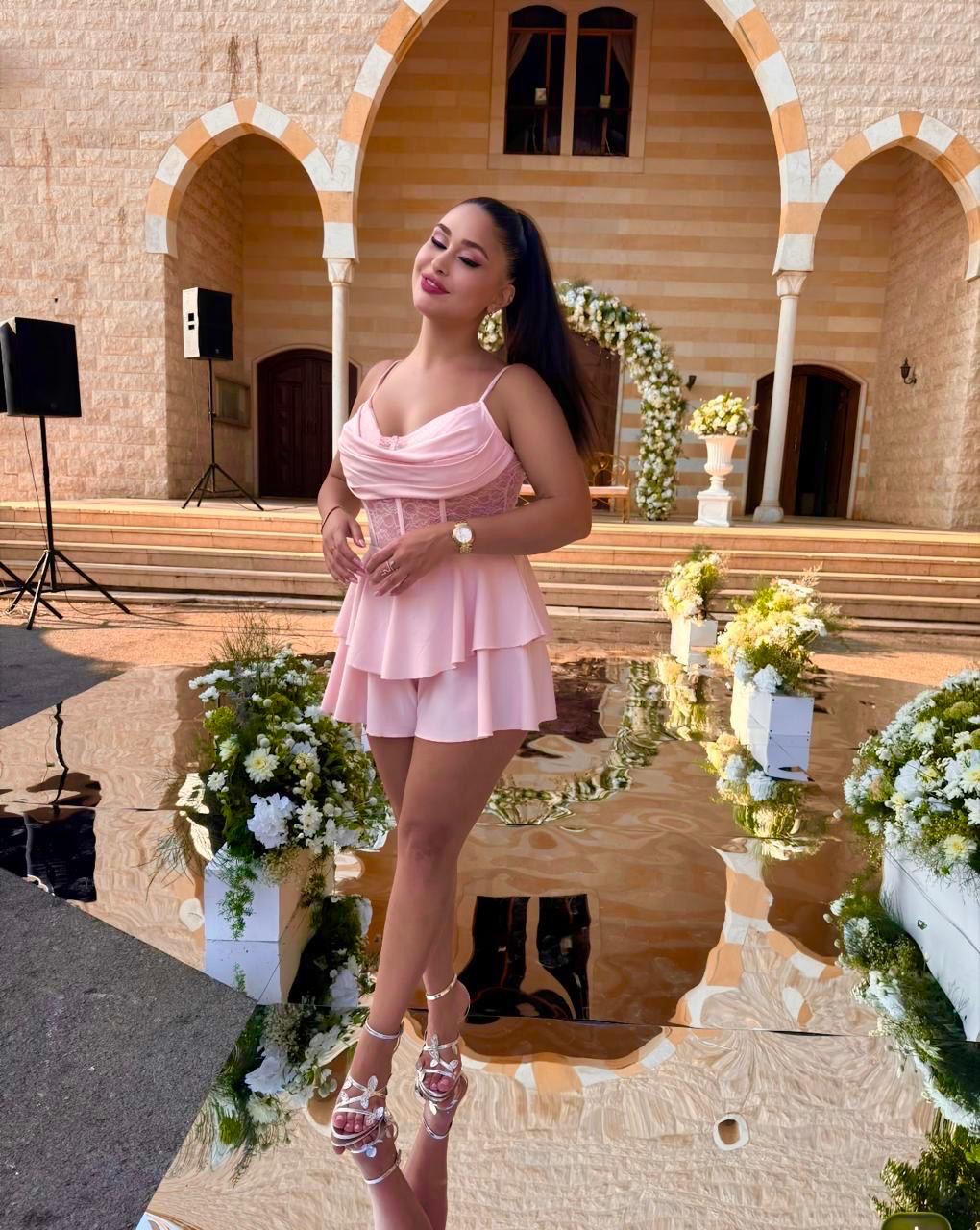 Dolly Ahmadieh hosting a formal gala event
